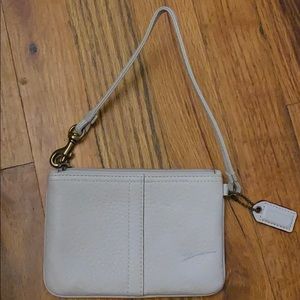 Small cream pebble leather coach wristlet